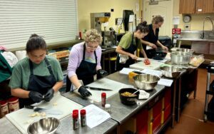 4 students in kitchen